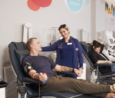 CBC phlebotomist attending to a blood donor.